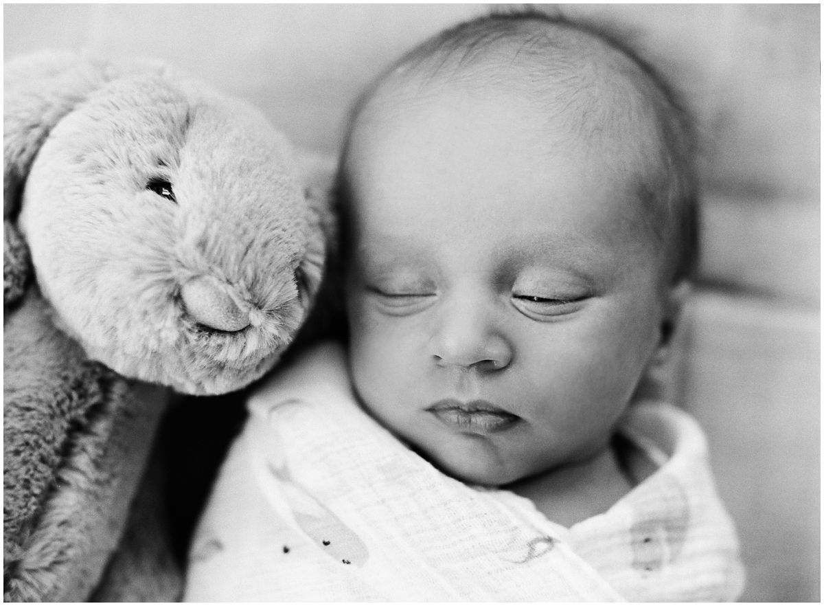 baby boy laying down with his little bunny captured by Newborn Photographer Miriam Dubinsky in Hoboken NJ