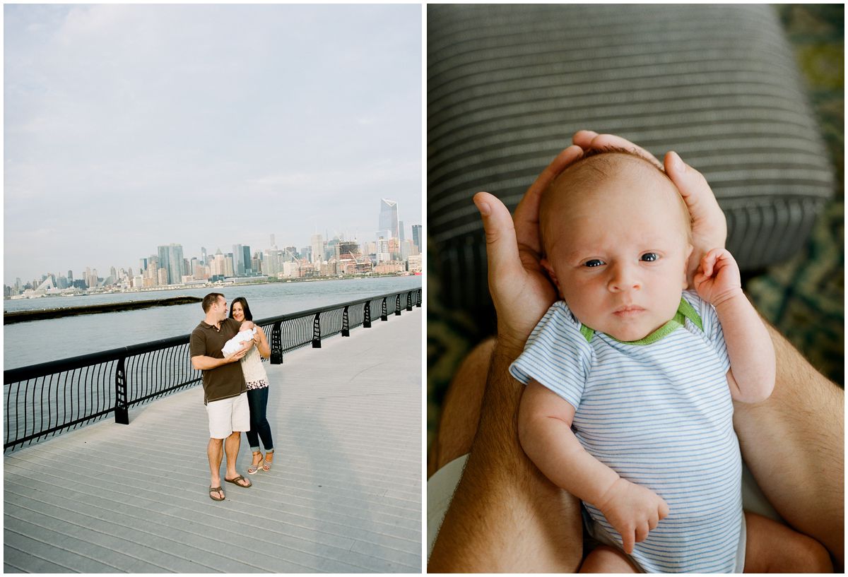 Mom and dad walking by Hoboken Waterfront and holding their newborn baby boy with blue eyes