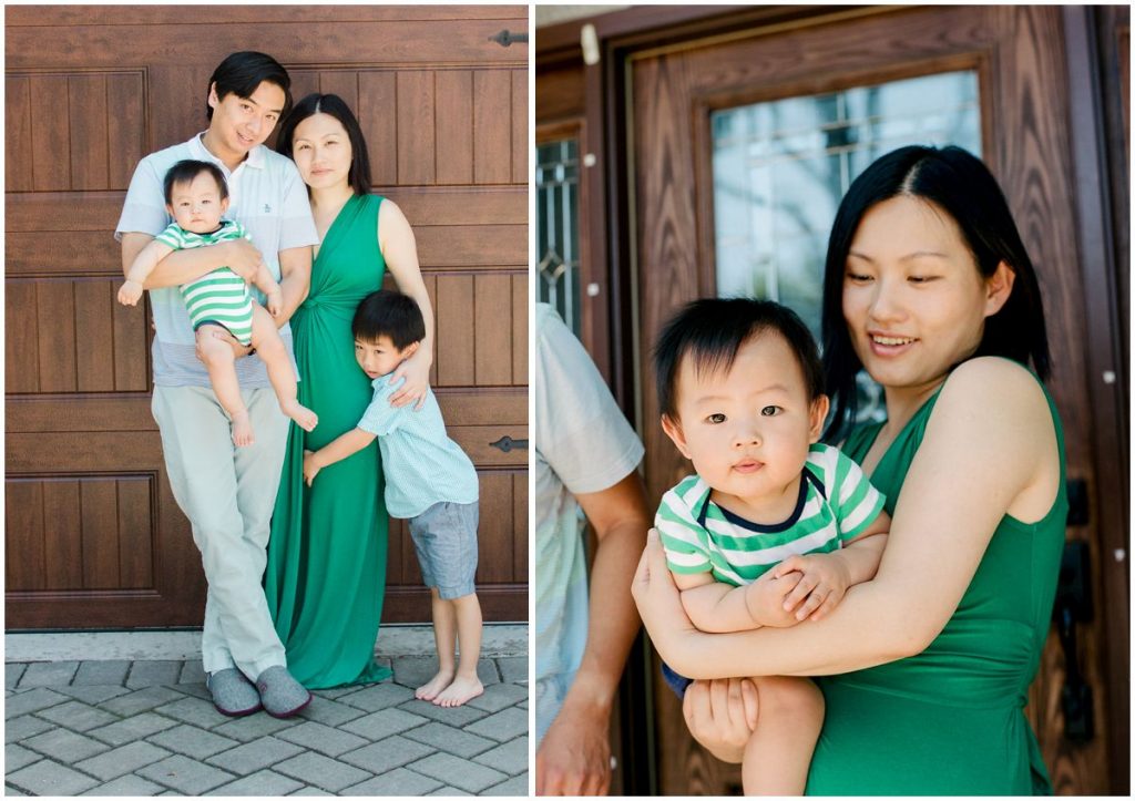 Family portrait of parents and kids in front of their NJ home wearing green and blue outfits