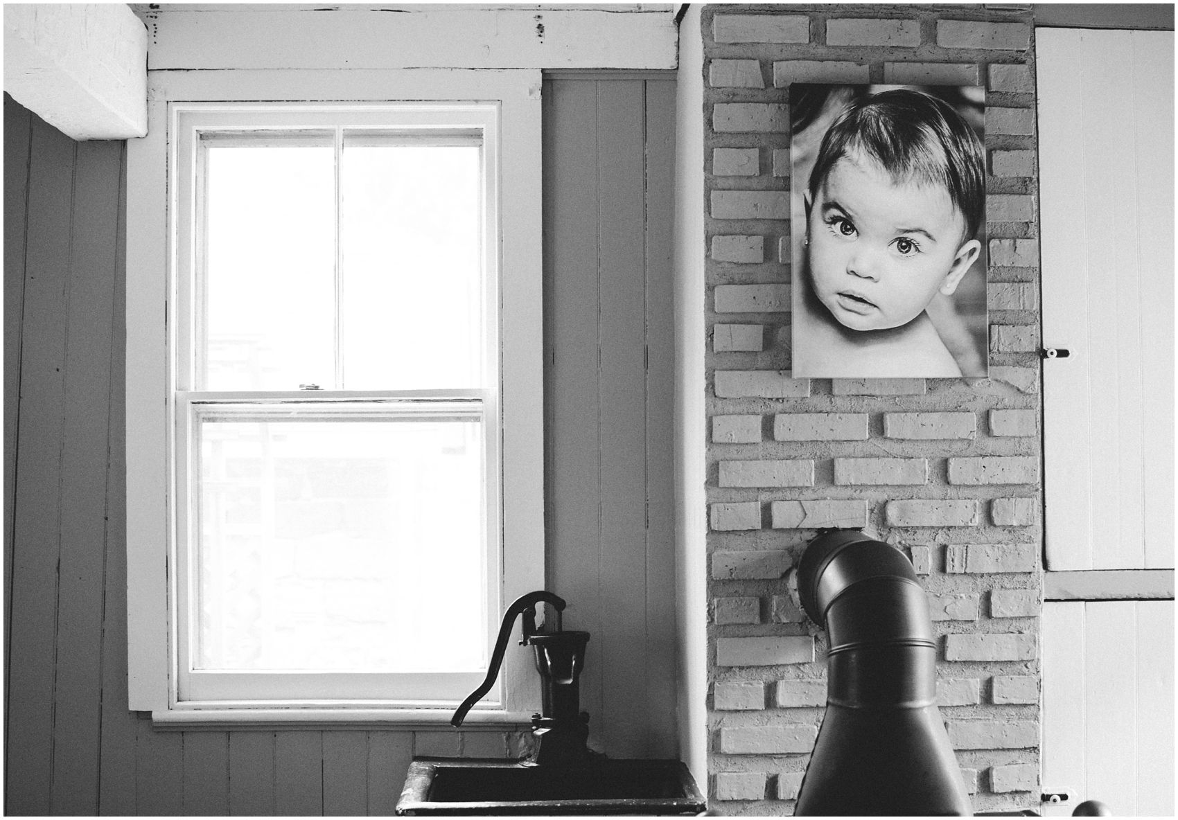 black and white portrait on the wall wow the little sister in Bergen County, NJ home