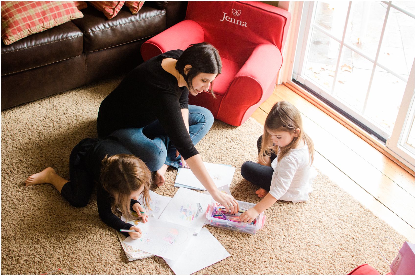 mother and daughter coloring on the floor of their beautiful house in Woodcliff Lake, NJ