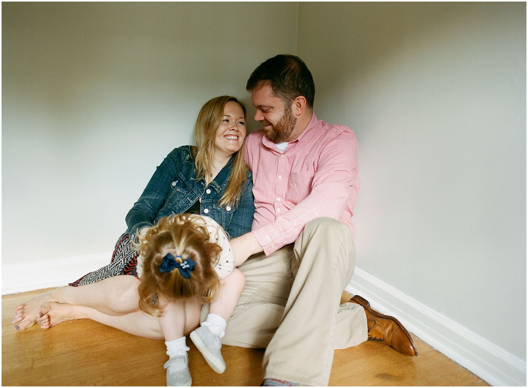 mom and dad laughing in family photos