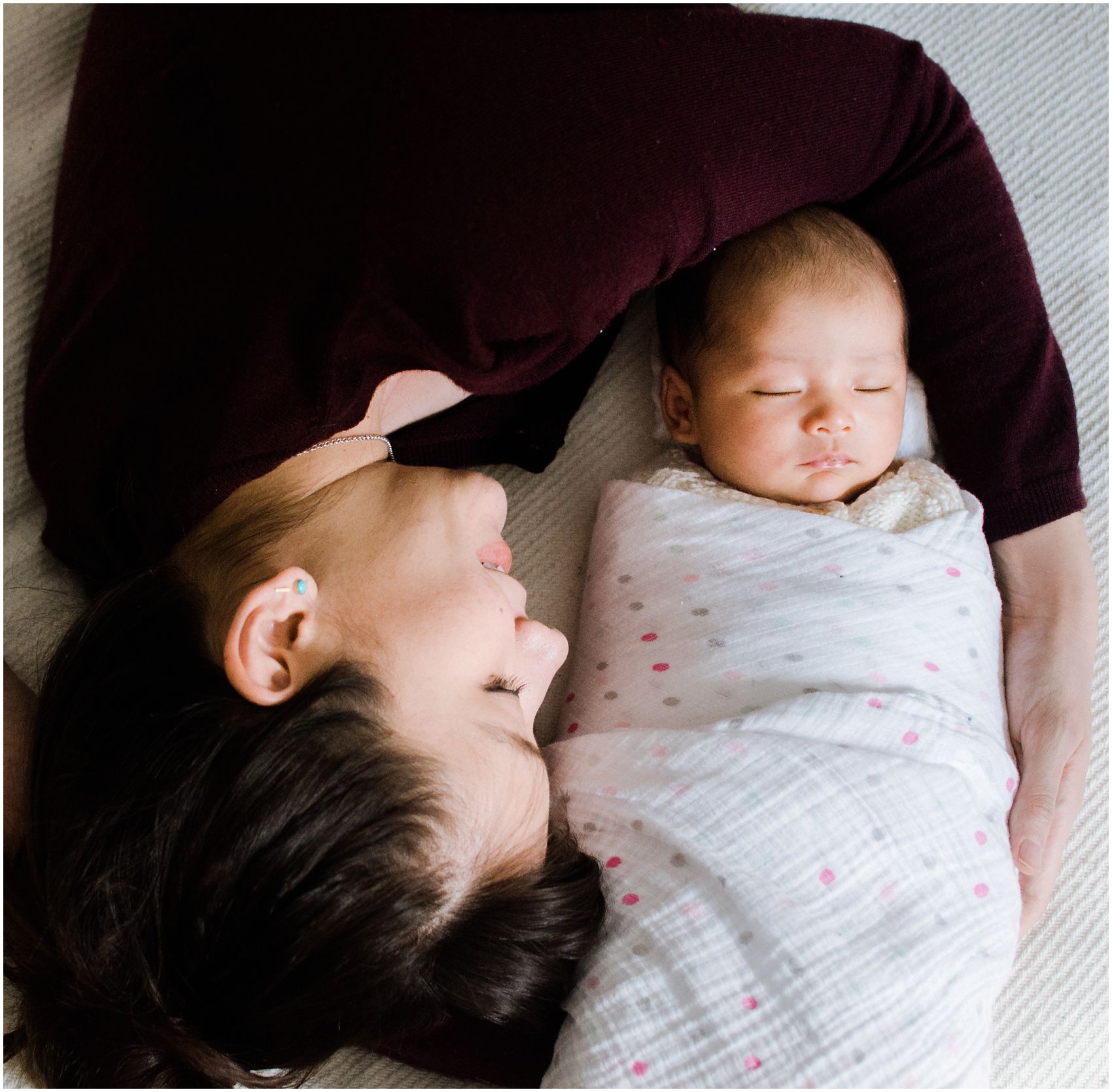 mommy wraps her hand around her new baby in NYC home
