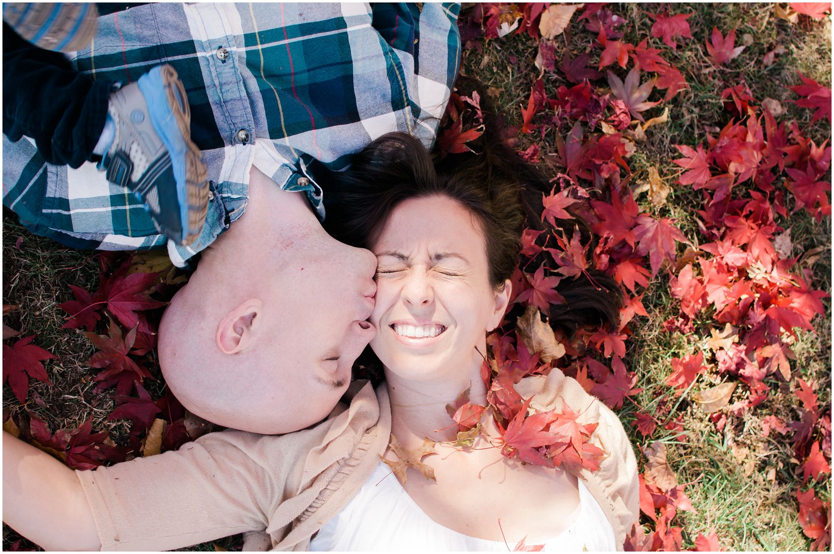 A husband kissing his wife in the backyard of his home in Rockland County, NY
