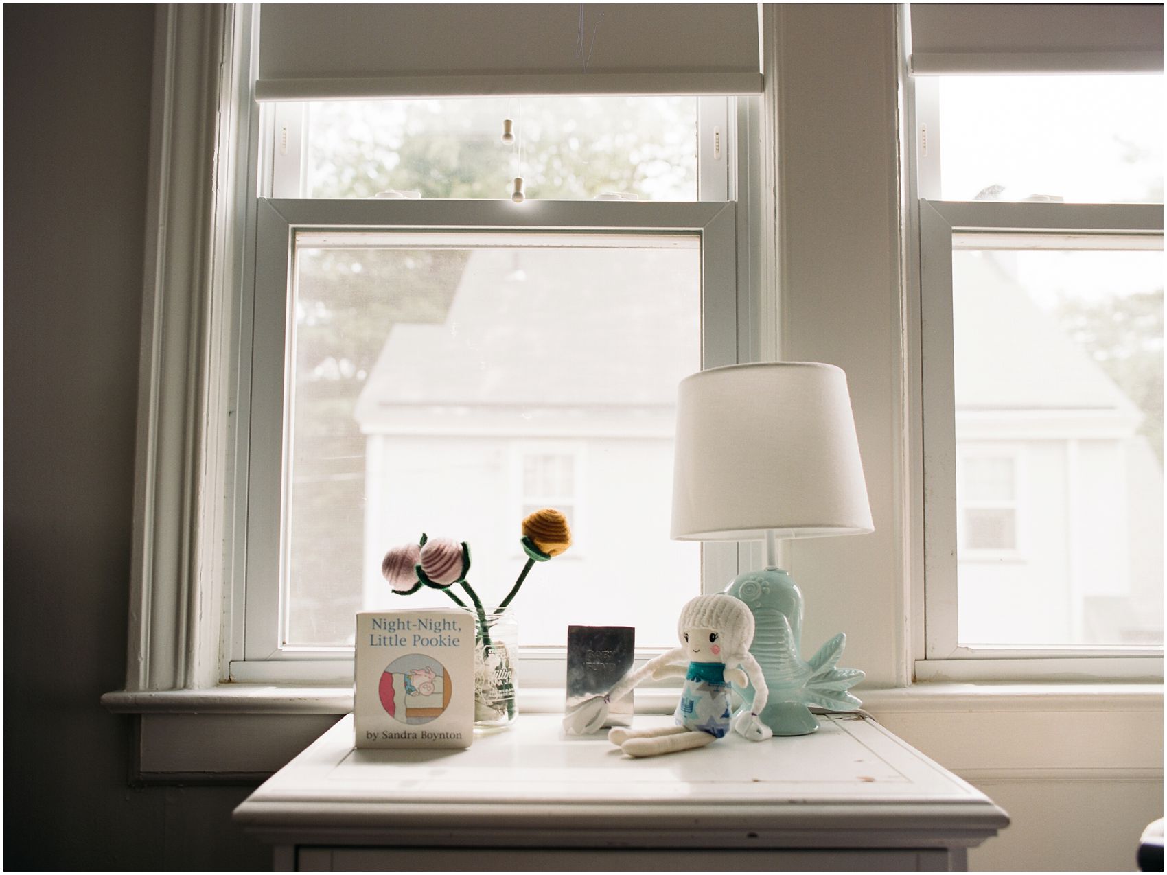 Detailed portrait of a windowsill of a child bedroom with toys and books in Essex County NJ home