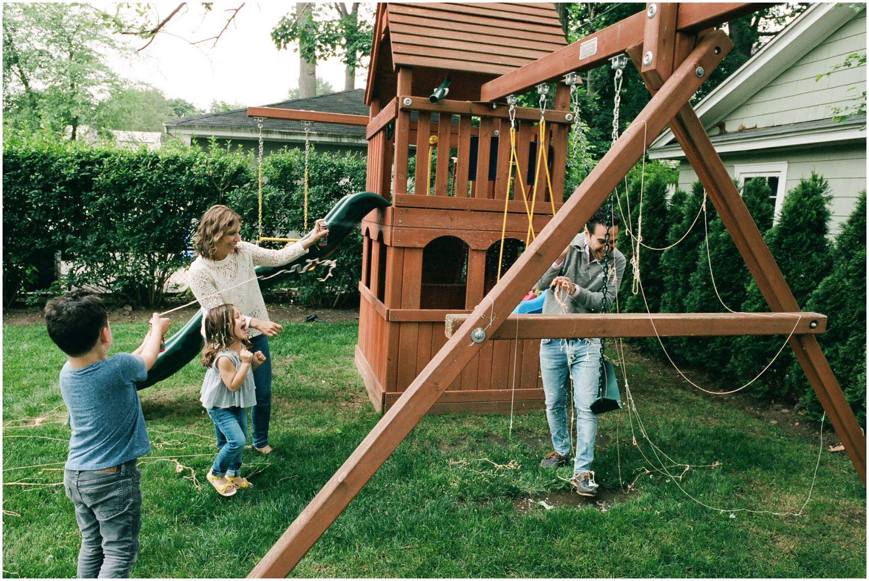sprinkle pray game in the backyard with mom dad and the kids in Essex County NJ home
