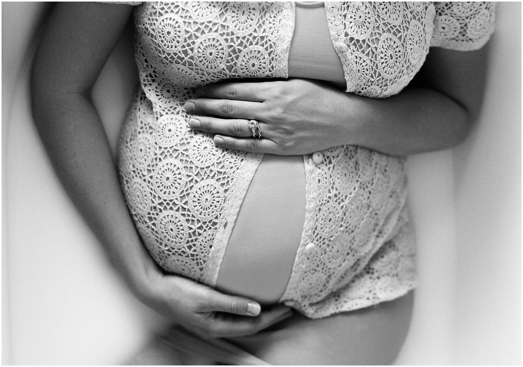 milk bath for pregnant mom wearing a crochet top and maternity dress