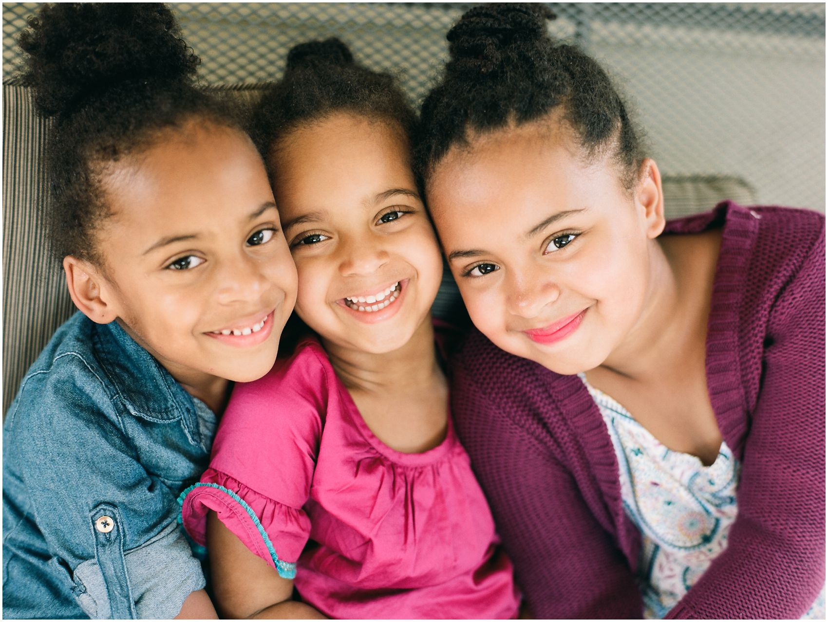 Family session with 3 sisters smiling together in West Orange NJ