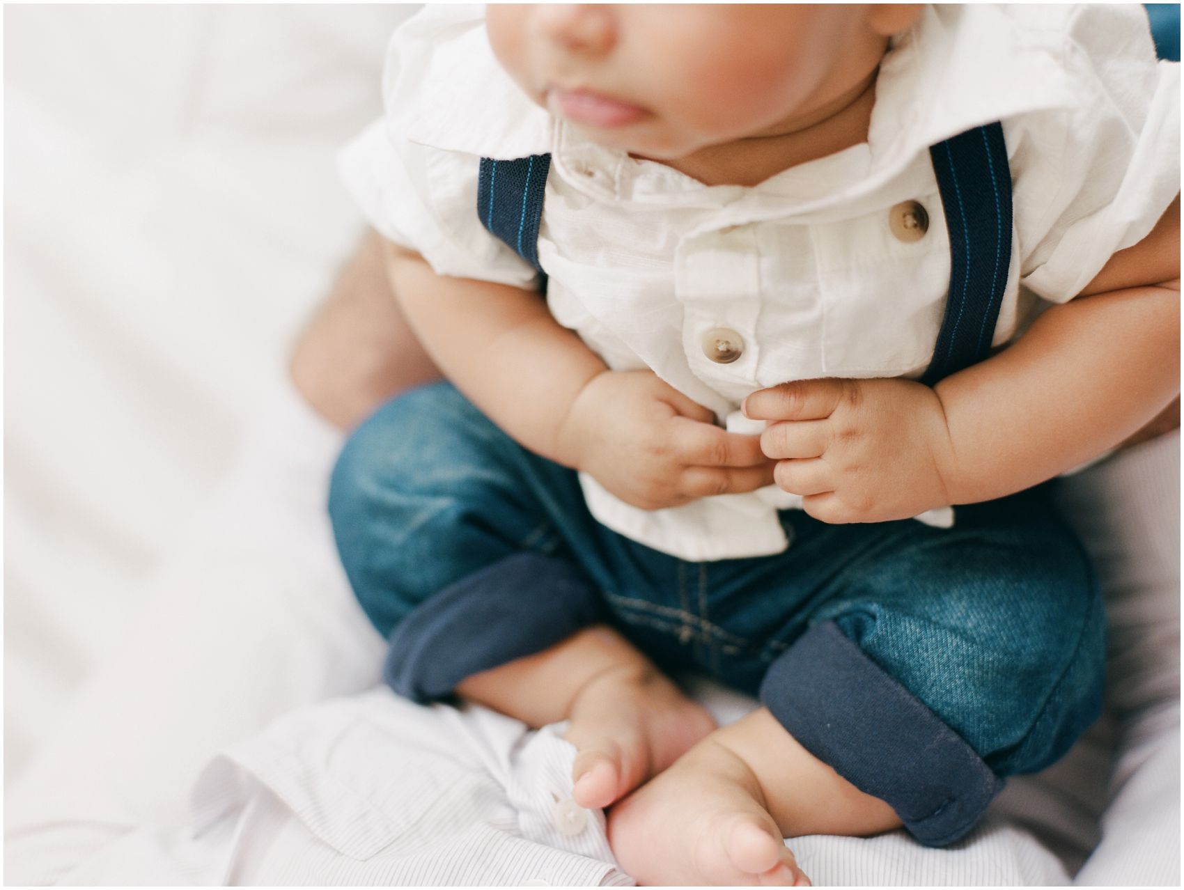 newborn photography NYC with puffy hands and feet of a baby boy