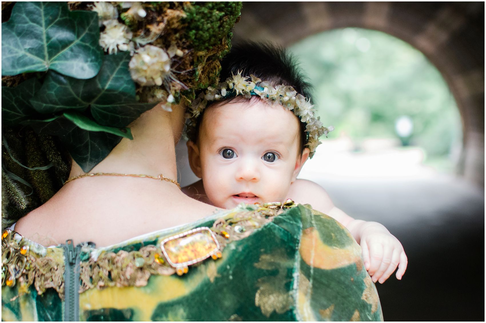 baby girl peeking over mom's shoulder in a dream photo shoot in Prospect Park of Brooklyn NY