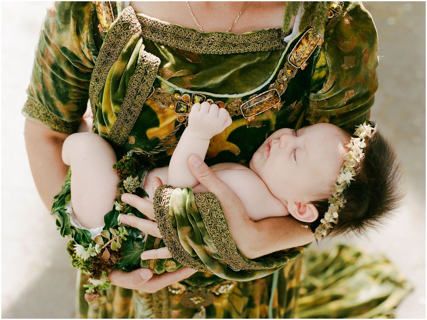 baby girl sleeping in her mother's arms captured by best newborn photographer Miriam Dubinsky