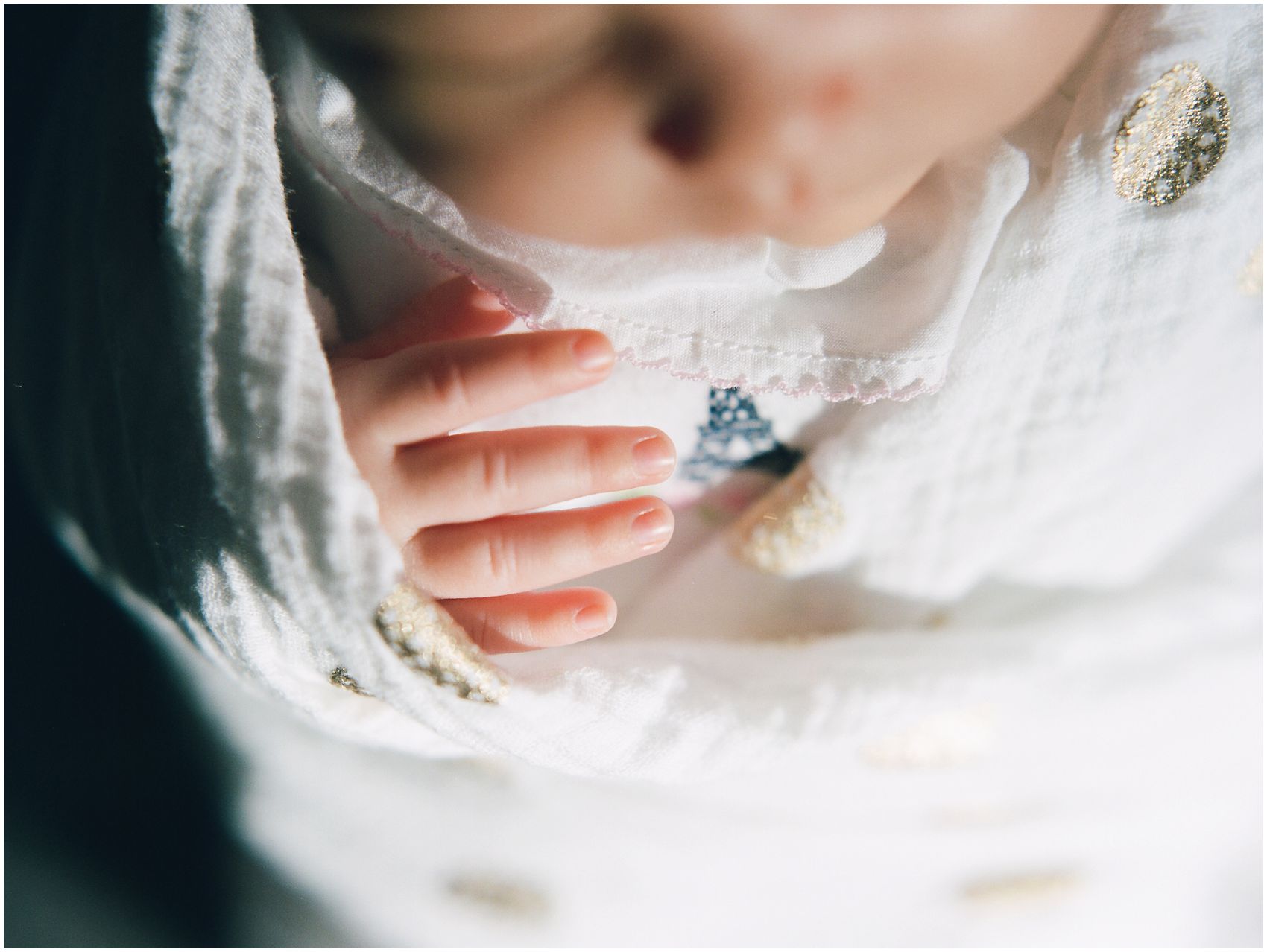 newborn photography of tiny baby fingers in a close up portrait