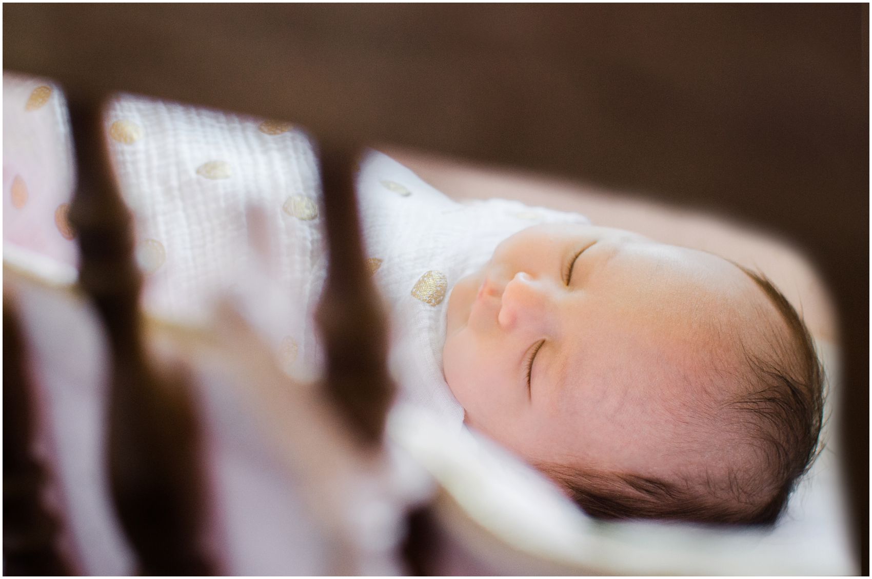 baby girl sleeping in her personal handmade crib during the newborn session by Miriam Dubinsky