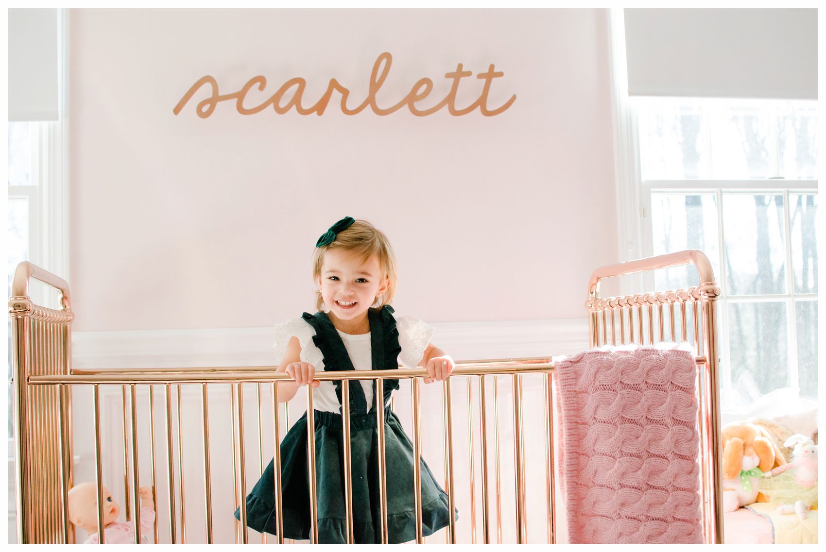 cute girl in green dress inside home home crib