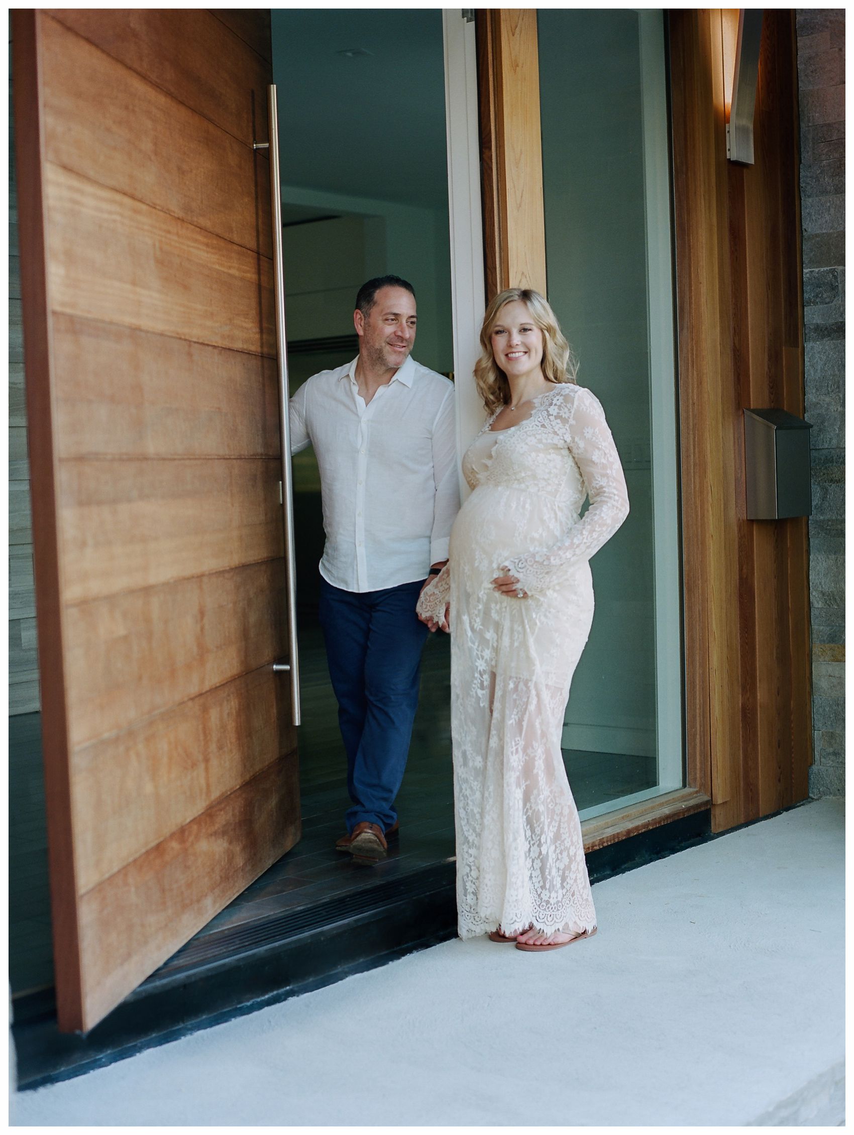 pregnant couple opening door to their home in Montclair NJ